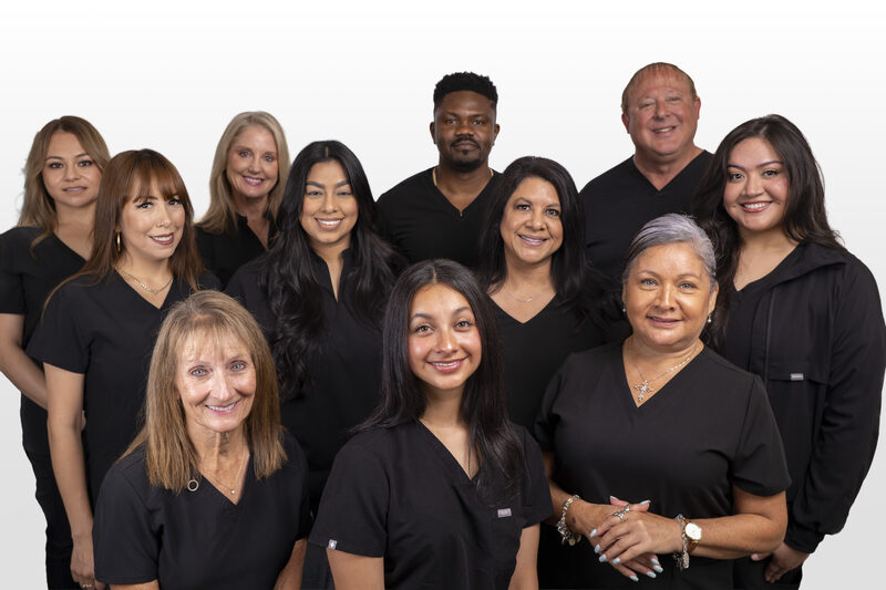 The full dental team at Marshall H. Brown, DDS in Fort Worth, Texas — doctors, hygienists, and front-office staff